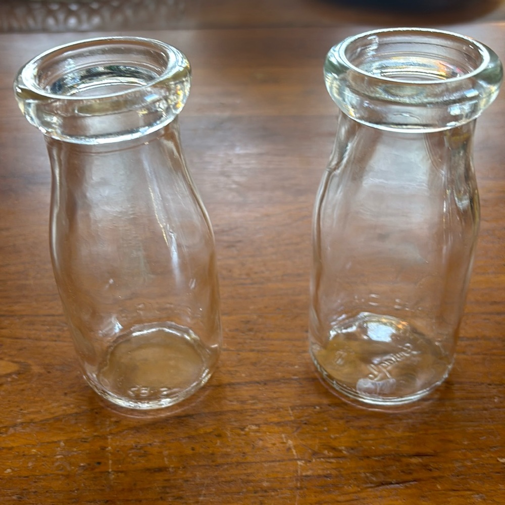 Vintage clear glass half-pint pair of milk bottles one marked “Duraglas”